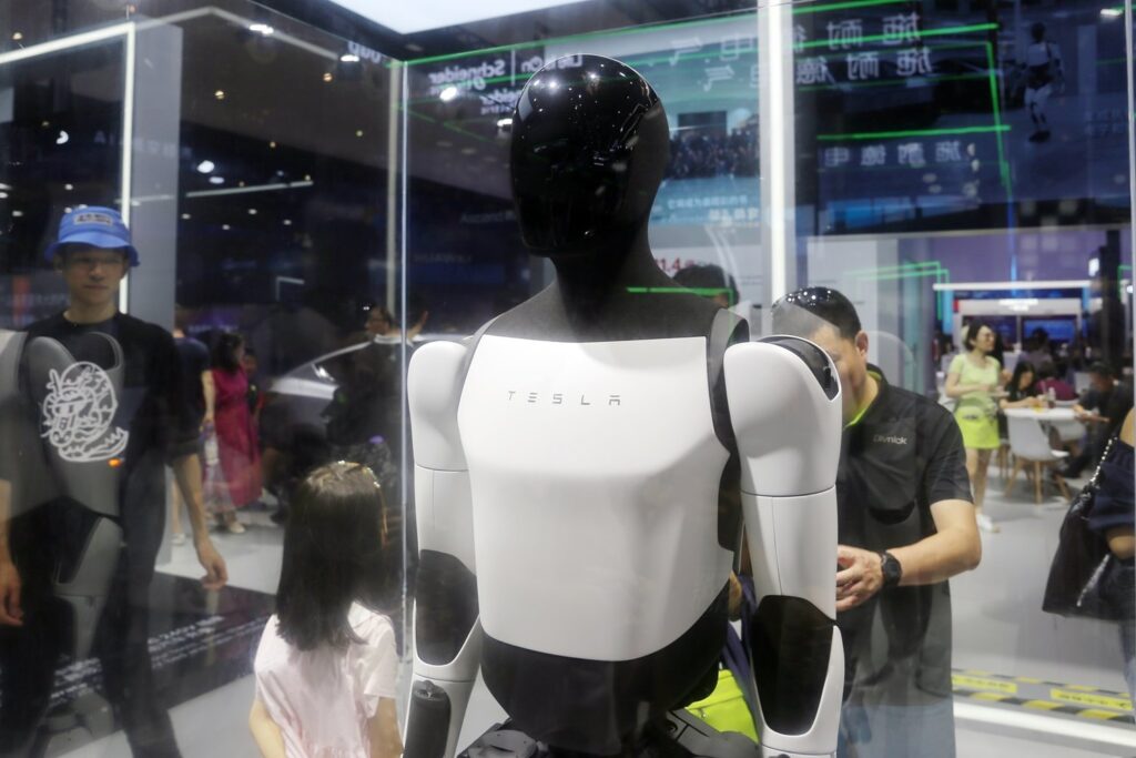 Optimus Robot Unveiled At World Robot Conference But Lacks Impressive